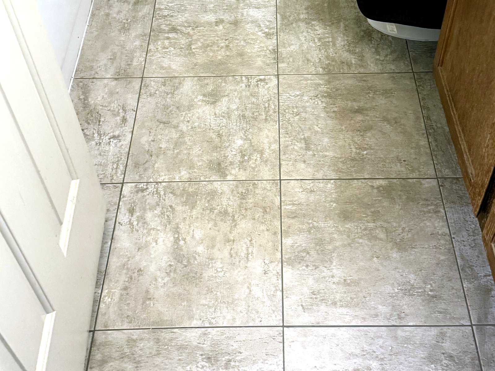 Large-format tile flooring installed in an Arizona home bathroom